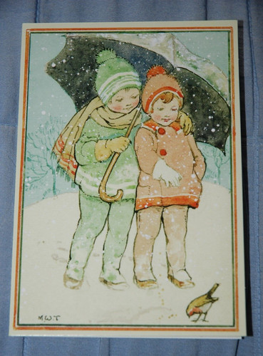 Children feeding robin in - a,